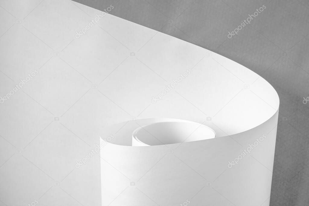 A roll of white paper in black and white.