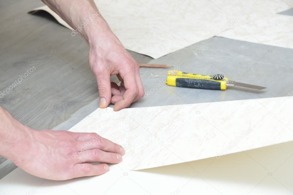 cutting and glueing wallpaper