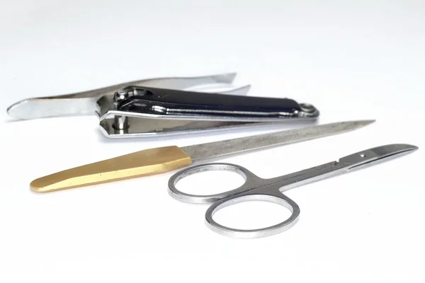 Nůžky, pilník, pinzeta — Stock fotografie