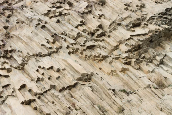 Ribbed texture of volcanic rocks on the cliff of Cape Fiolent — Stock Photo, Image