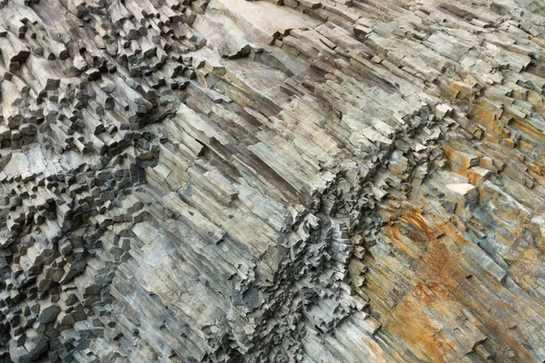 Ribbed texture of volcanic rocks on the cliff of Cape Fiolent — Stock Photo, Image