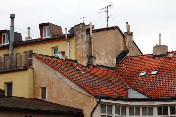Red tiled roofs, the walls of houses and chimneys