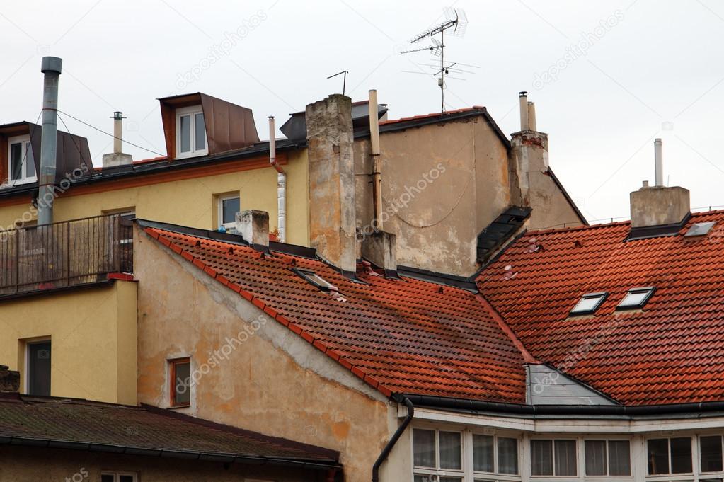 Red tiled roofs, the walls of houses and chimneys