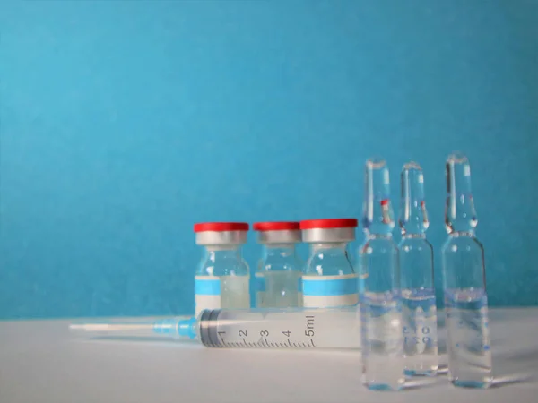Influenza vaccine, syringe, and vials