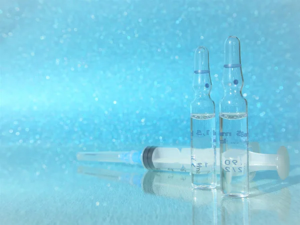 Vaccines and syringes. Influenza vaccine, syringe, and vials