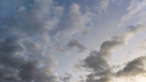 evening sky with white and gray clouds.