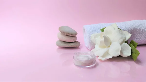 Spa setting and Spa background composition with white gardenia flower on pink background. Banne