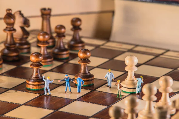 Teamwork Concept Miniature Chess — Stock Photo, Image