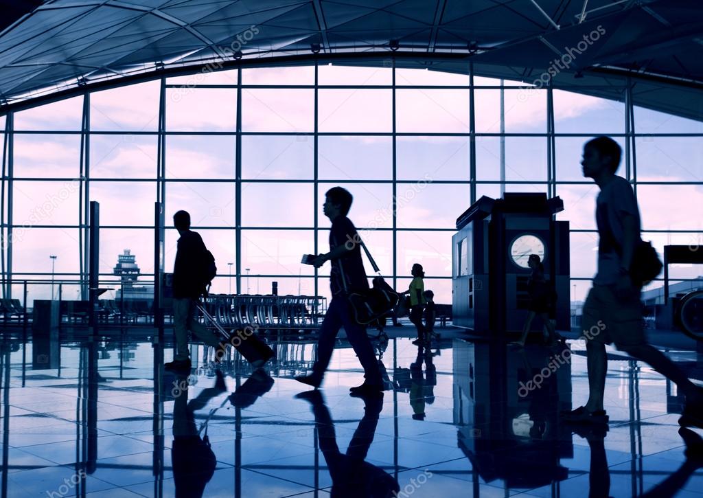 Airport terminal hall. Walking travelers