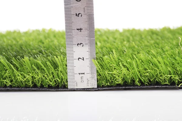 Plastic lawn on a white background — Stock Photo, Image