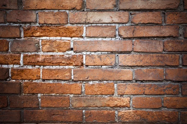 Red brick background: closeup of an old uneven brick wall. — Stock Photo, Image