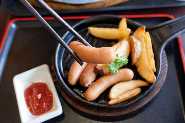 Fried sausage with potatoes — Stock Photo, Image