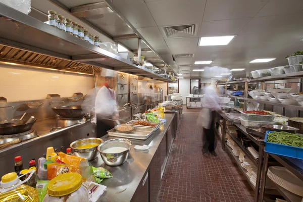 Chef cooking at commercial kitchen - hot job! — Stock Photo, Image