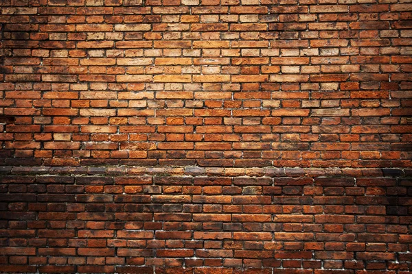 Fundo de tijolo vermelho: close-up de uma antiga parede de tijolo desigual . Fotografias De Stock Royalty-Free