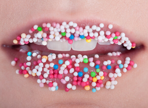 Sprinkles on lips of a woman