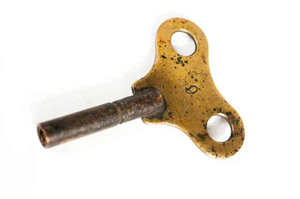 Brass wind-up key — Stock Photo, Image
