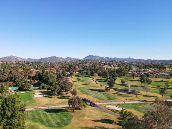 Aerial view of golf in green valley — Stock Photo, Image