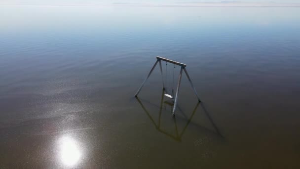 Abandoned swing in the water at Bombay beach, Salton Sea, California , United States — Stock Video
