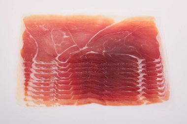 Jamon, Prosciutto, Speck, Dry Cured Meat or Ham slices on white background. Studio shot