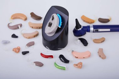 Various hearing aids and ENT toolson white background, alternative to surgery. ENT accessory. clipart