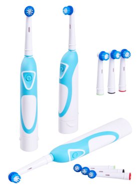 Spare brush heads and electric toothbrush isolated on white background with clipping path. Such brush cleans much more effectively than a conventional toothbrush.