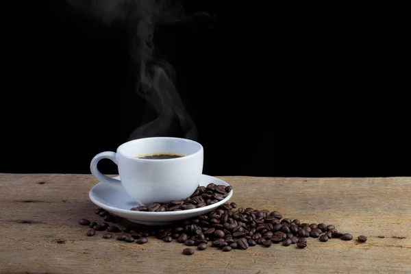 Kaffeetasse auf altem Holzgrund — Stockfoto