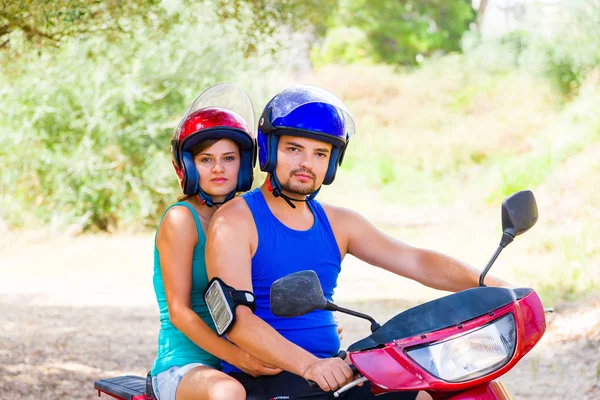 Young couple on a motor scooter — Stock Photo, Image