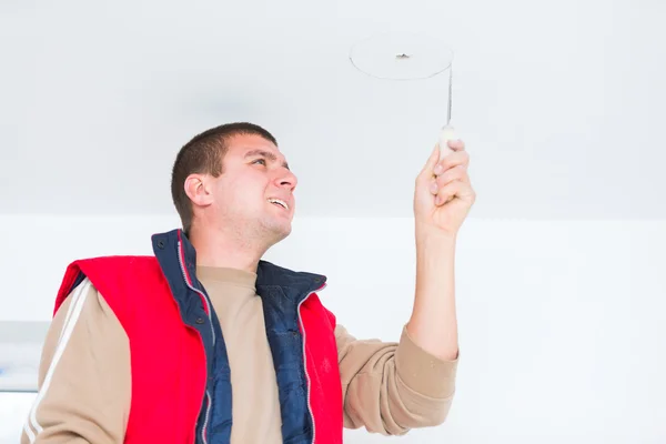 Electrician working with wires and other utensils — Stock Photo, Image