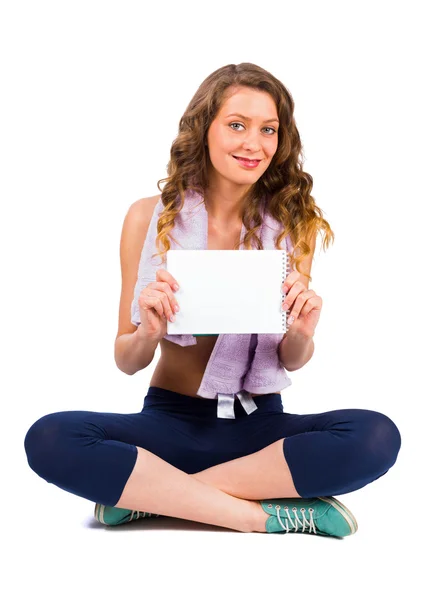 Mujer sosteniendo tablero en blanco — Foto de Stock