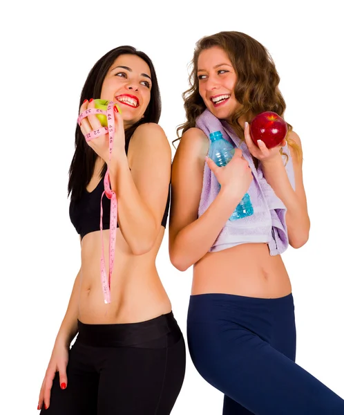 Mujeres riendo comiendo comida saludable — Foto de Stock