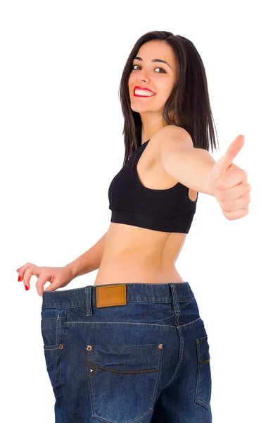 Slim woman showing thumbs up Stock Image