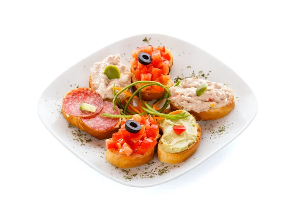 Bruschette, guacamole, tuna and salami sandwich — Stock Photo, Image