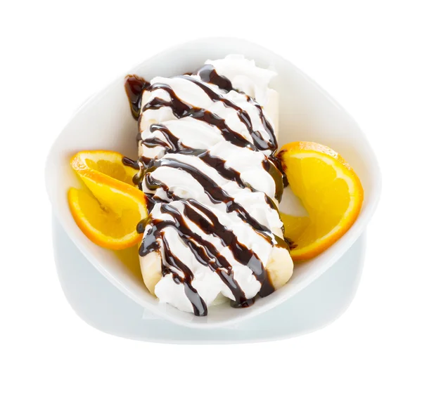 Tasty banana split on a white bowl. — Stock Photo, Image