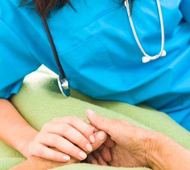 nurse holding elderly woman's hand clipart