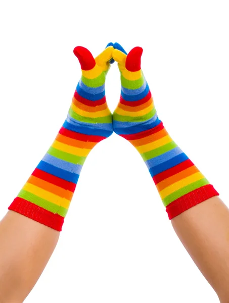 Enfant coloré heureux rayé chaussette jouer — Photo