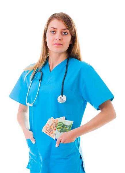 Läkare med pengar och ett allvarligt ansikte — Stockfoto