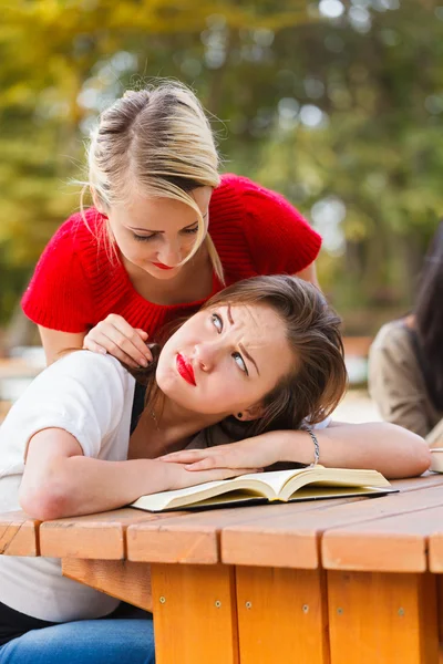 Girl woken up by collegue girl — Stock Photo, Image