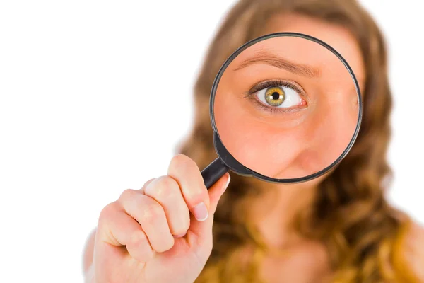 Lady holding a magnifying glass Royalty Free Stock Images