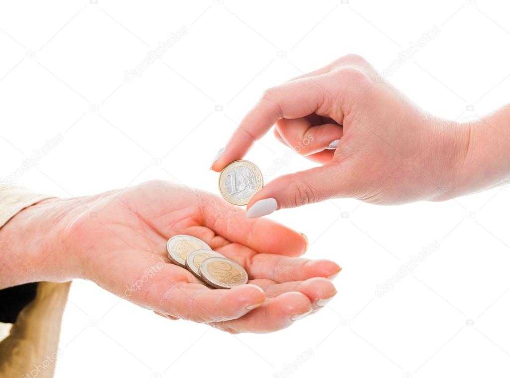 Elderly beggar receiving euro coins as donation