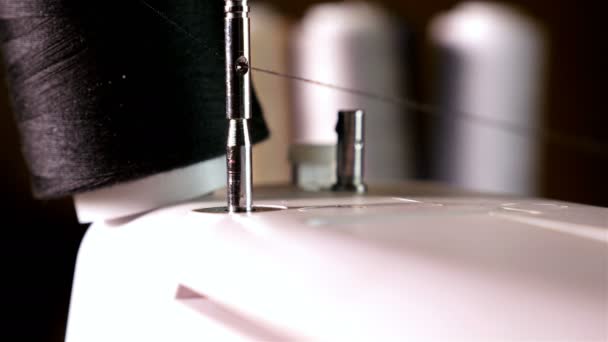 Spool of sewing thread on the sewing machine, close-up — Stock Video