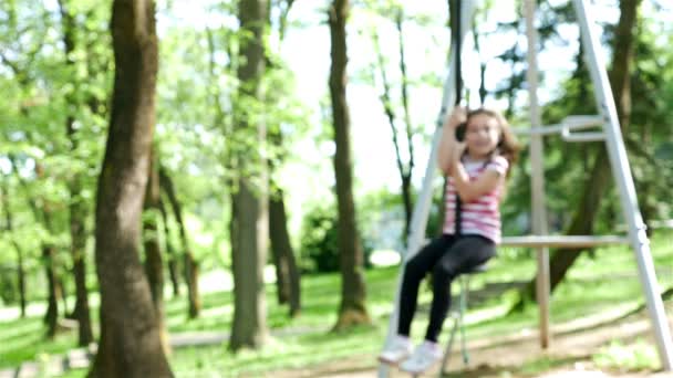 A cute young girl goes zip lining — Stock Video