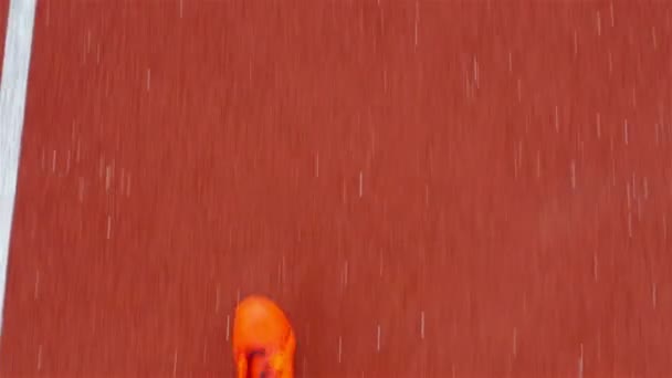 Tracking camera of the shoes of a track runner / athlete running in a line, top view — Stock Video