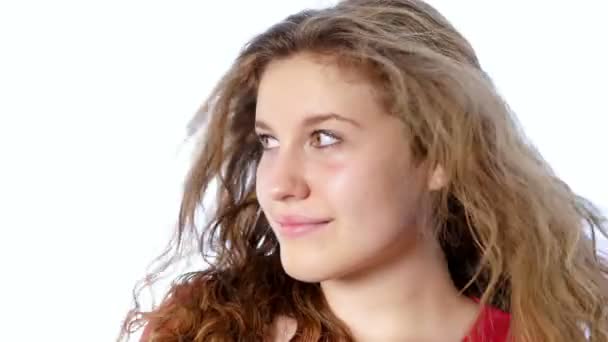 Portrait of a beautiful teenager girl on a white background — Stock Video