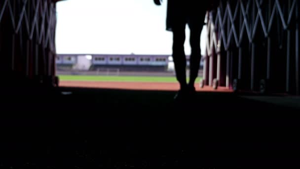 Silhouette of a football player going out to the stadium — Stock Video