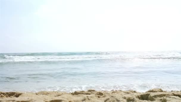 Cute little girl in swimsuit playing at the sea beach — Stock Video