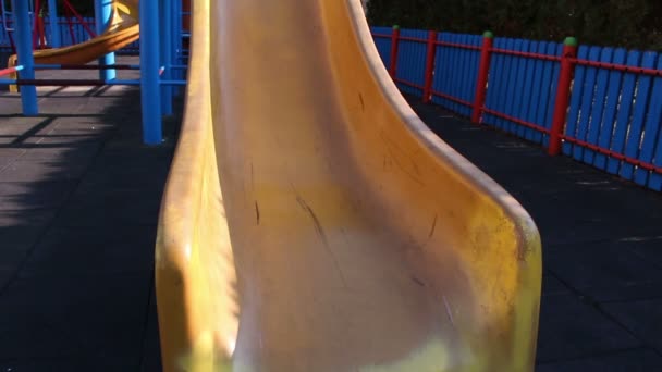 Young girl having fun on a slide — Stock Video