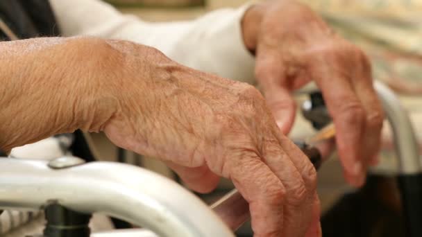 Close up of the hands of an old woman on a crutch — Stock Video