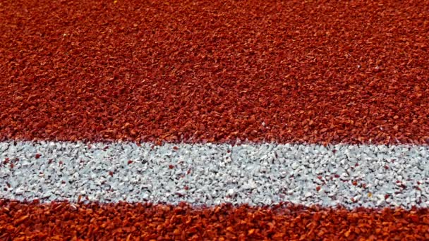 Tennis ball bouncing on a red tennis court — Stock Video