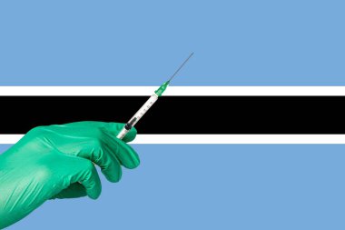 Botsvana bayrağı önünde korona aşısı