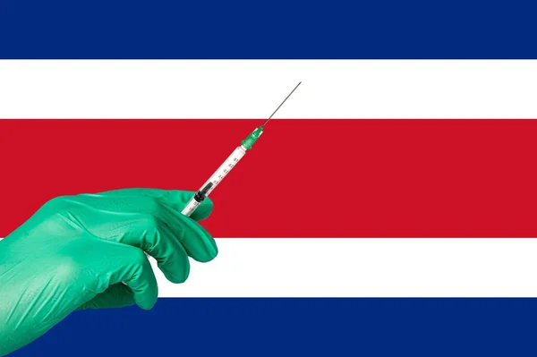 Εμβολιασμός κατά της κορώνας μπροστά από σημαία της Κόστα Ρίκα — Φωτογραφία Αρχείου